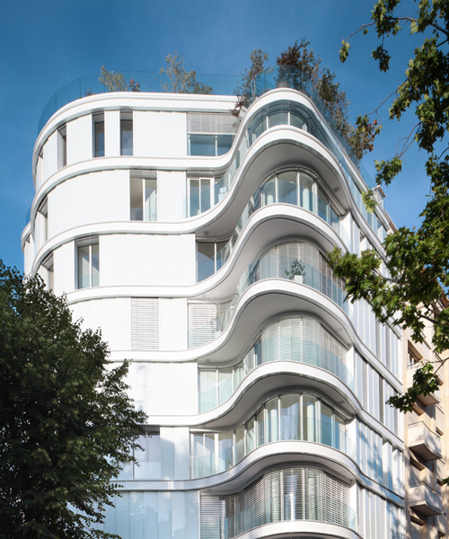 ecdm's parisian residential scheme outlined by curving glass walls