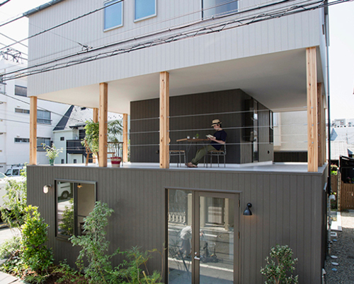 furuya design lifts upper level of japanese house to form sheltered balcony