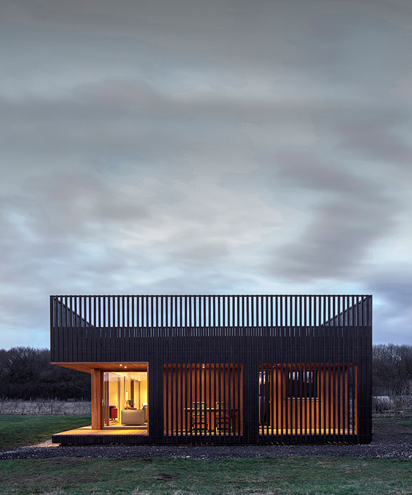IPT architects clads howe farm residence in charred timber planks