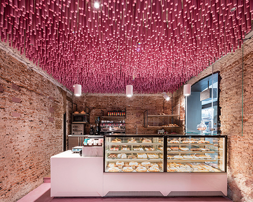 ideo arquitectura adds undulating pink canopy to madrid pastry shop