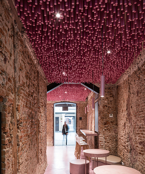 ideo arquitectura adds undulating pink canopy to madrid pastry shop
