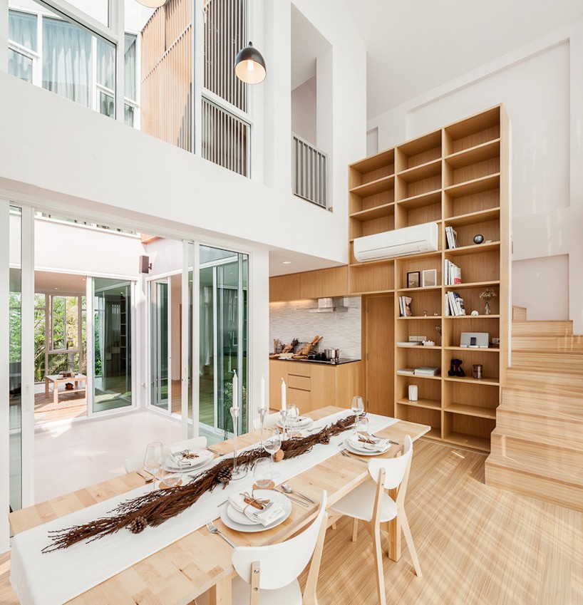 integrated field seamlessly blends home with office in bangkok apartment