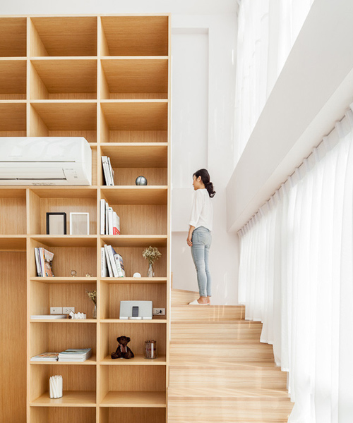 integrated field seamlessly blends home with office in bangkok apartment