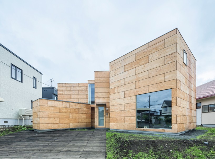 jun igarashi organizes artist-studio home within connected wooden blocks in japan
