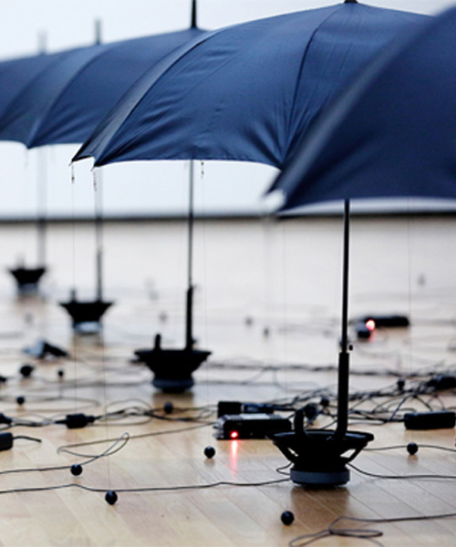 kouichi okamoto's rain installation expresses gravity, magnetic forces, and sound