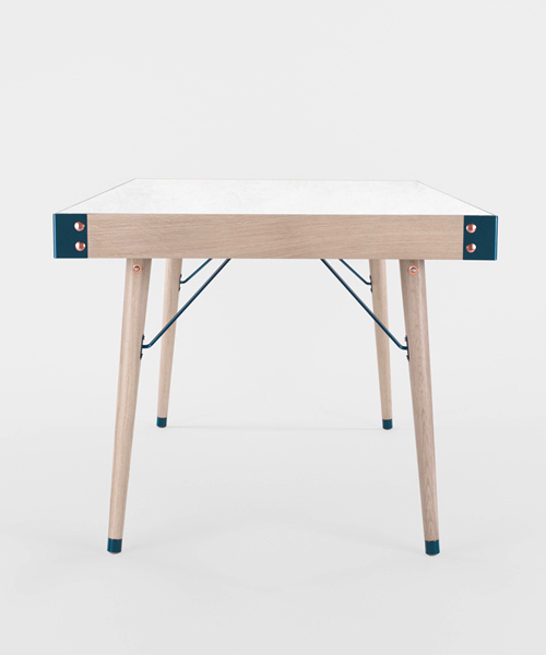 miltonpriest assembles communauté dining table with hand-buffed copper rivets