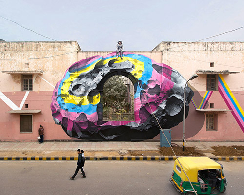 nevercrew sits an astronaut on top of their new delhi street intervention