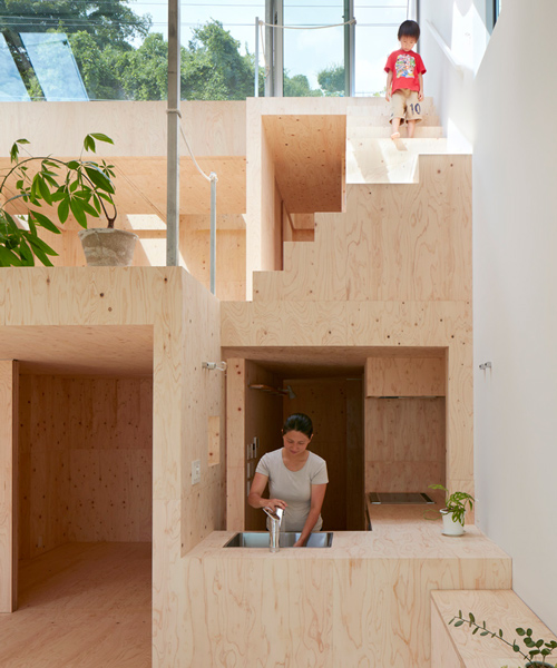 tomohiro hata's hillside house interior integrates terraced platforms