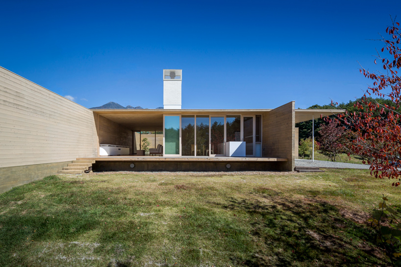shigeru ban designs 'miesian' house in japan built from solid cedar