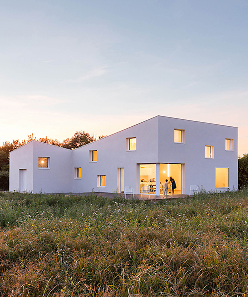 studio razavi adds square openings to define photographer’s house façade in france