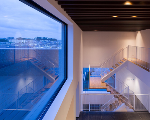 tsushima design studio frames views inside of monolithic house in japan