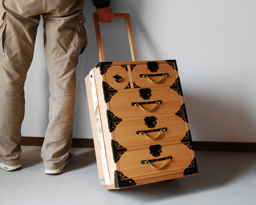 yuukou yamaguchi turns traditional japanese tansu chests into contemporary trolley cases