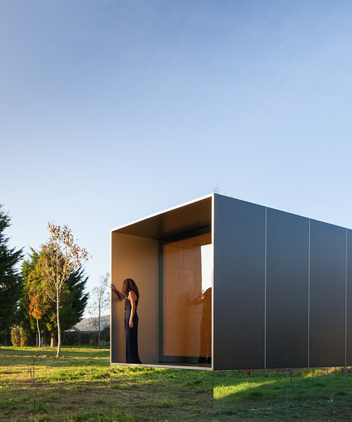 prefabricated 'MIMA light' dwelling appears to levitate above the ground