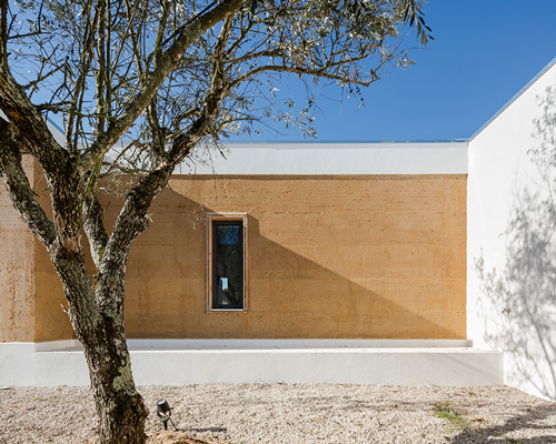 blaanc's vineyard house in portugal is clad with rammed earth façades
