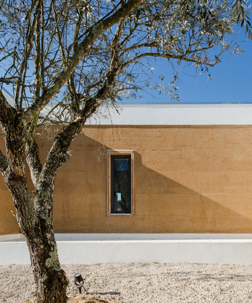 blaanc's vineyard house in portugal is clad with rammed earth façades