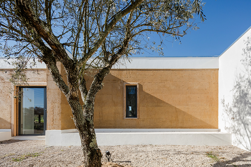 blaanc's vineyard house in portugal is clad with rammed earth façades