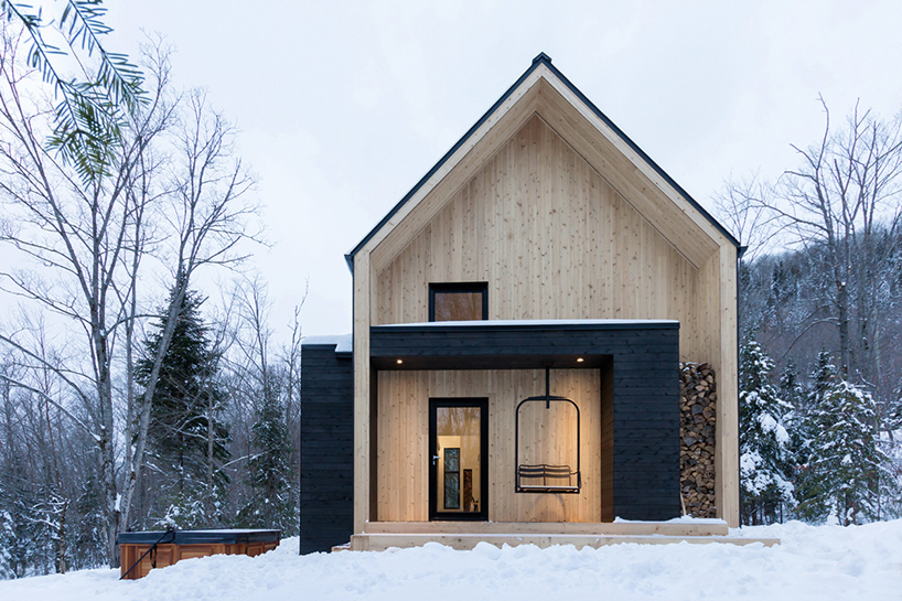 cargo architecture clads villa boreale in quebec with black metal and white cedar
