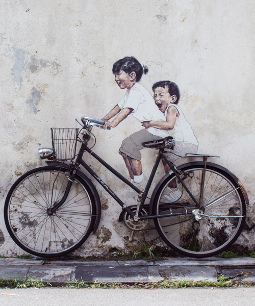 ernest zacharevic's artistic interventions engage with their urban surroundings