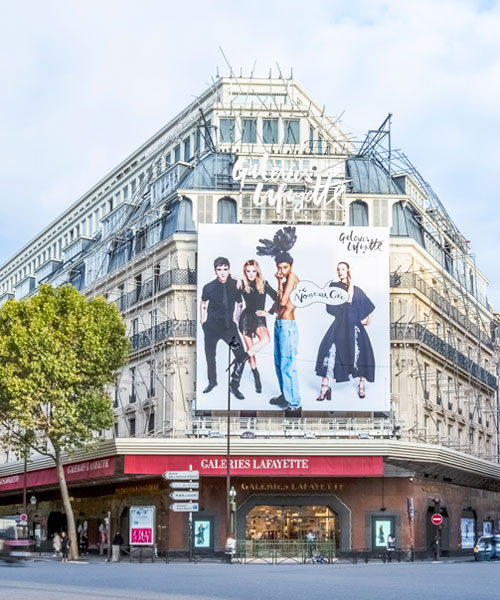 Galeries Lafayette exterior with advertising hoarding boulevard