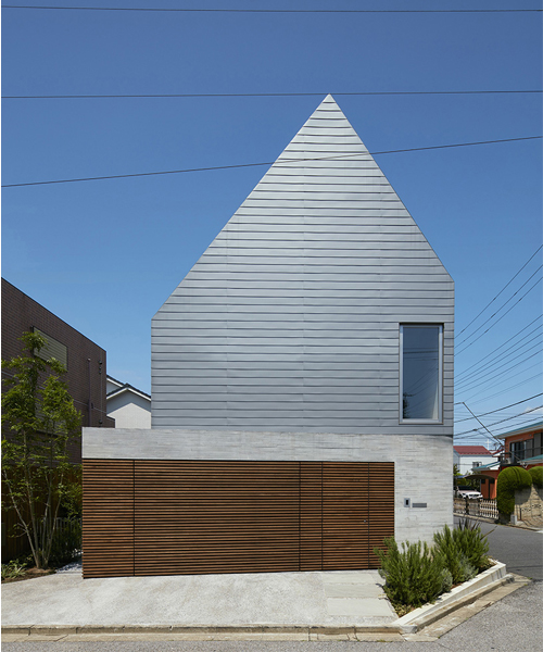 KIAS sits asymmetrical gabled volume on concrete bases in tokyo