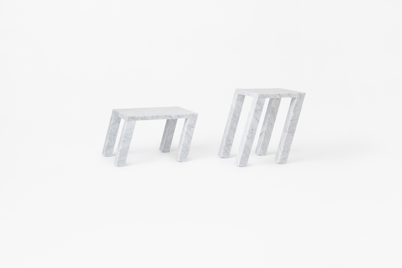 nendo's sway table for marsotto edizioni gives marble an agile appearance