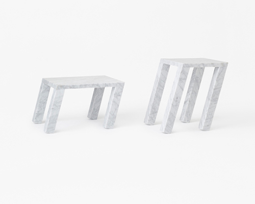 nendo's sway table for marsotto edizioni gives marble an agile appearance