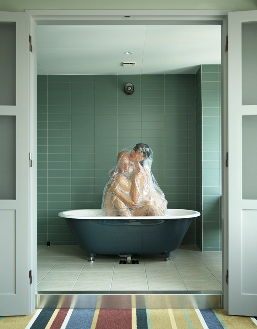 photographer hal returns with vacuum sealed couples in intimate spaces
