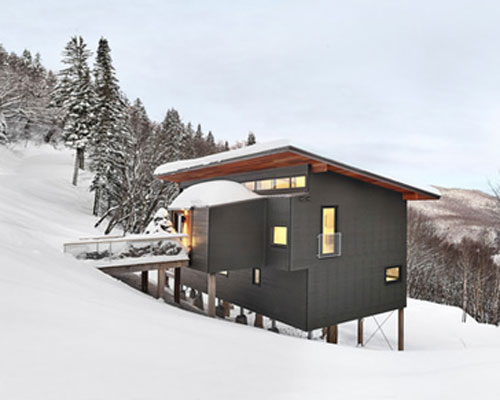 robitaillecurtis elevates ski chalet on the snow-covered slopes in quebec