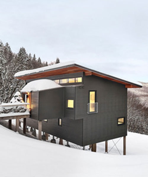 robitaillecurtis elevates ski chalet on the snow-covered slopes in quebec