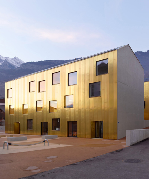 childcare center in switzerland by savioz fabrizzi has shimmering golden façades