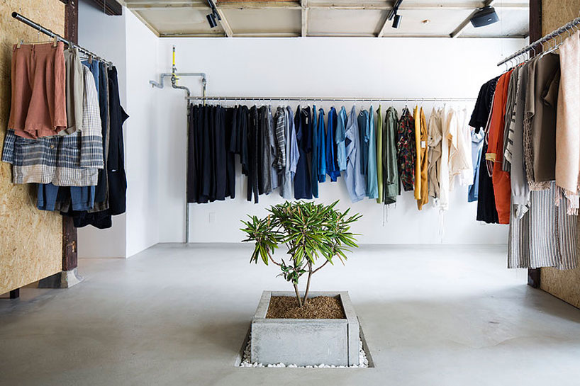studio201architects enhances vintage clothing store with plants and plywood