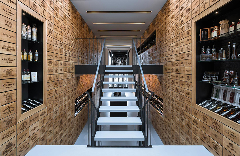 rotterdam wine shop by studio AAAN features laser engraved oak cabinets