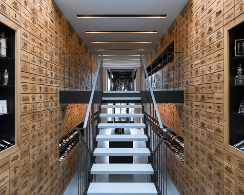 rotterdam wine shop by studio AAAN features laser engraved oak cabinets