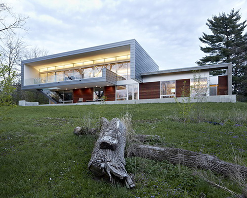 studio dwell architects designs intimate river view house in illinois