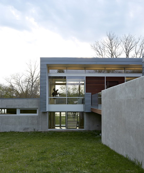 studio dwell architects designs intimate river view house in illinois