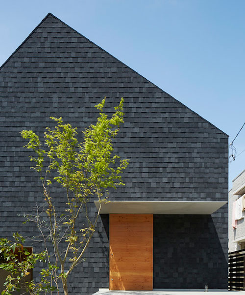 trees and light filter through house in anjo by suppose design office