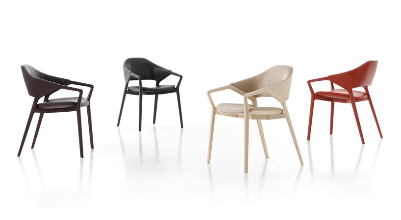 ico chair by ora ïto for cassina features a curved wooden frame with sharp graphic cutouts