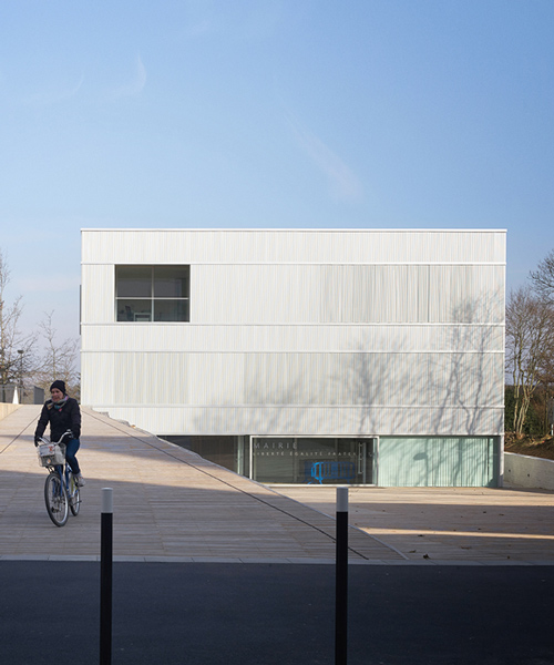 LAN architecture wraps contemporary town hall in france with double façade
