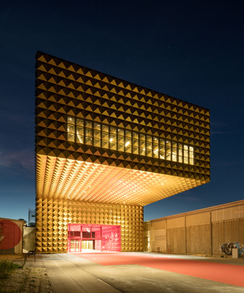 MVRDV + COBE open a gold-studded cantilevered rock museum in denmark