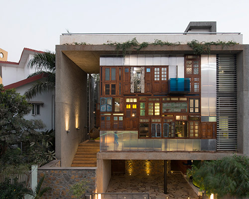 S+PSARCHITECTS adds recycled doors and windows to mumbai house façade