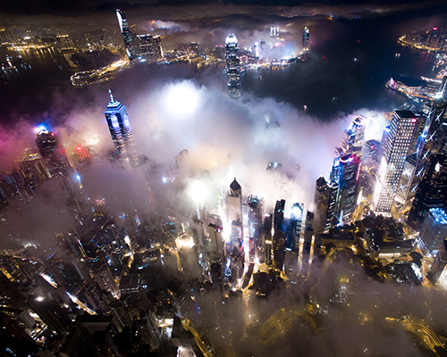 andy yeung's drone photos rise above hong kong at night to capture urban fog