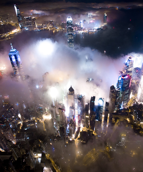 andy yeung's drone photos rise above hong kong at night to capture urban fog