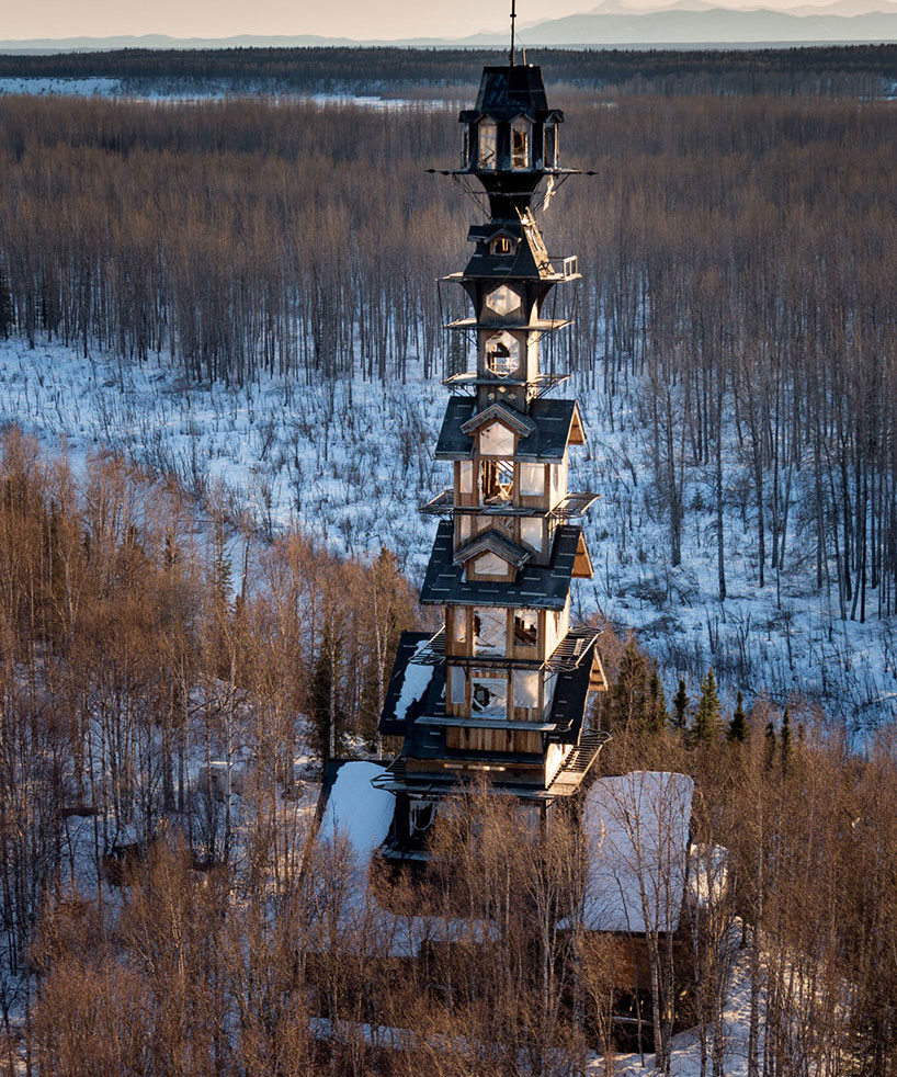 alaskan attorney builds 185 foot stacked log cabin tower in the wilderness