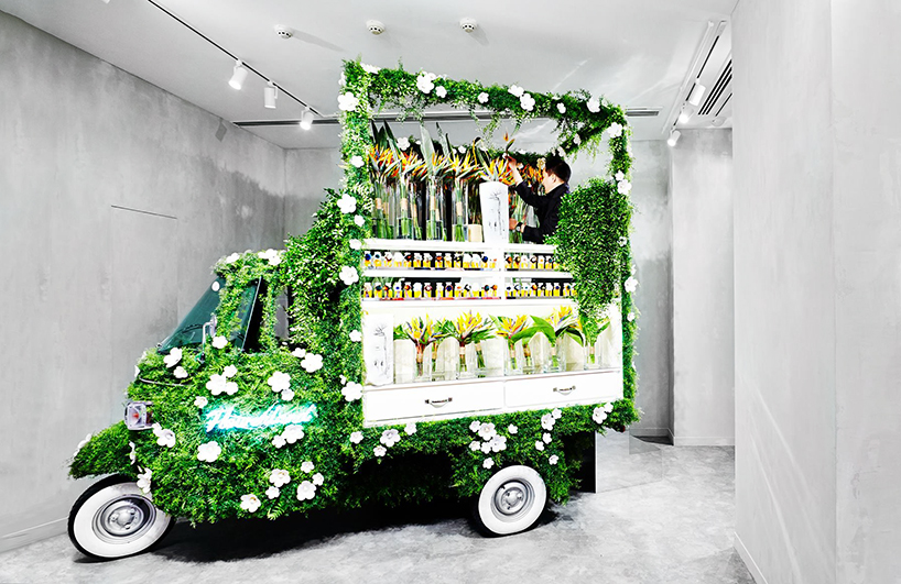 azuma makoto converts a piaggio scooter into a mobile flower shop for fendi
