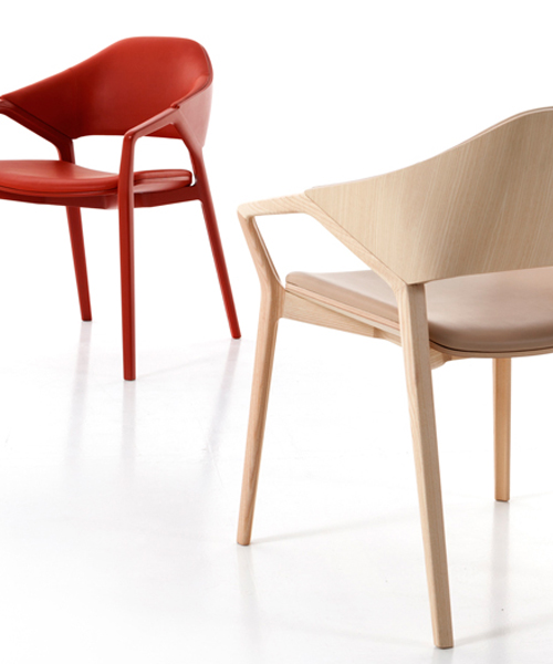 ico chair by ora ïto for cassina features a curved wooden frame with sharp graphic cutouts