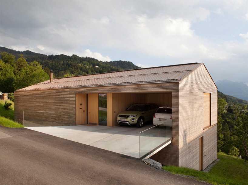 dietrich | untertrifaller recesses garage into wooden hill-edge residence in austria
