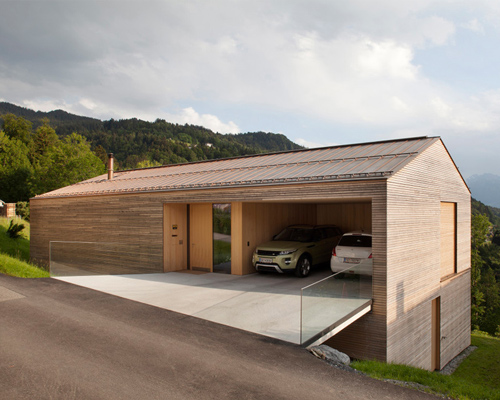 dietrich | untertrifaller recesses garage into wooden hill-edge residence in austria