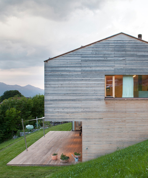 dietrich | untertrifaller recesses garage into wooden hill-edge residence in austria