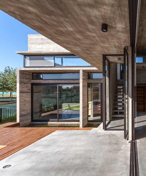 besonias almeida intersects concrete planes to form residence in argentina