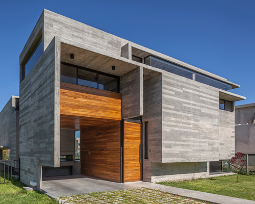 besonias almeida intersects concrete planes to form residence in argentina